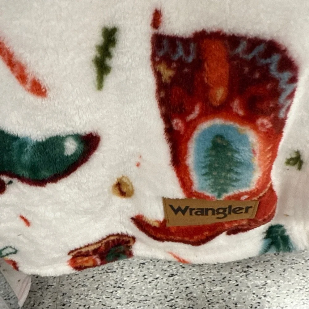Wrangler Plush Throw with Red and Green festive Webstern boots Accents